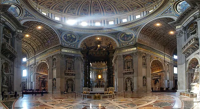 Wide view inside St Peter's Basilica: Bernini's bronze baldachin over the papal altar, with the great dome high above